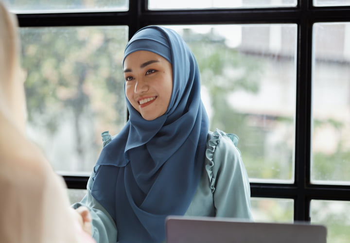 Smiling woman in a bright setting